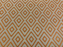 Load image into Gallery viewer, Lalla Diamond Indoor
Outdoor Fabric orange white versatile woven fabric with diamond motifs shown in terracotta